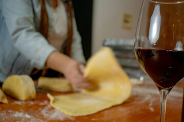 beautiful woman kneading to make pasta