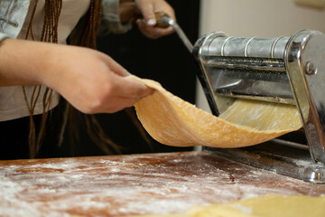beautiful woman kneading to make pasta