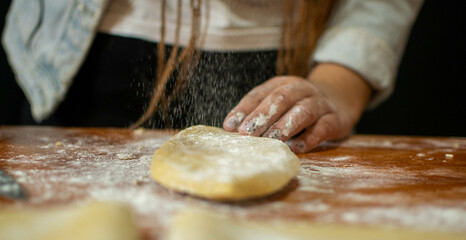 beautiful woman kneading to make pasta