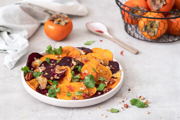 Winter salad of beets, persimmons, lemon and cilantro