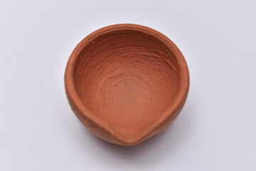 Indian clay oil lamp or diya used for Diwali and festival celebration isolated with white background