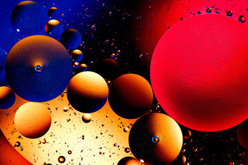 Abstract colorful background of oil circles. Oil in circles on the water surface, water foam and...