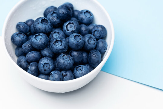 Fresh Blueberries In Bowl Isolated On White. Top View.