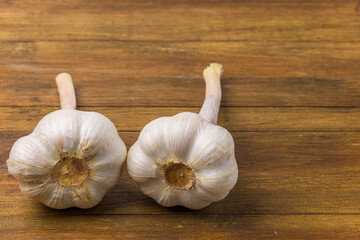 Close up view of two heads garlic isolated on wood background. Beautiful background.