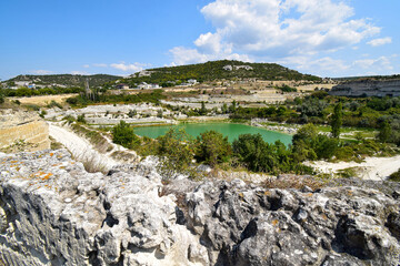 A lake formed in an old quarry for the extraction of stone