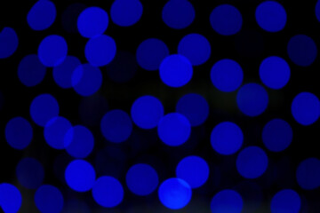 Christmas and New Year holidays and decorations. Blurred background with bokeh, lights, illumination. New Year, festive, winter background. Night city. Decorative frame, web banner.