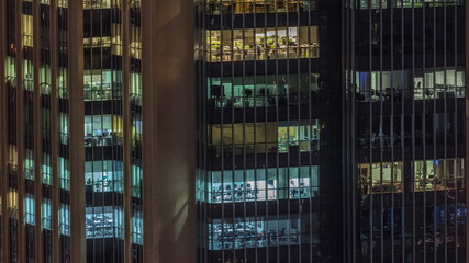 Windows lights in modern office buildings timelapse at night