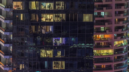 Windows lights in modern office and residential buildings timelapse at night