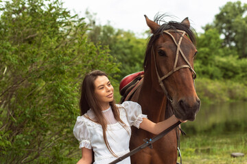 Fototapeta premium Walk with a horse near the river