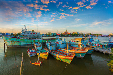Naklejka na ściany i meble Many boats moored in sunrise morning time at Chalong port, Main port for travel ship to krabi and phi phi island, Phuket, Thailand