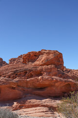 Fototapeta premium Valley of Fire State Park is a public recreation and nature preservation area covering nearly 46,000 acres located 16 miles south of Overton, Nevada. The state park derives its name from red sandstone