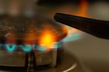 Household gas burner with flame, gas cost concept