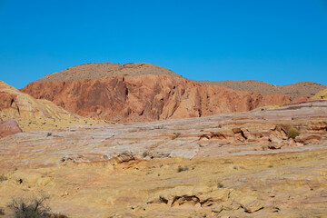 Valley of Fire State Park is a public recreation and nature preservation area covering nearly 46,000 acres located 16 miles south of Overton, Nevada. The state park derives its name from red sandstone