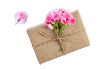 Box with gift and pink flower on white, isolated, top view.