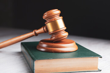 the judge's hammer and the book on the table