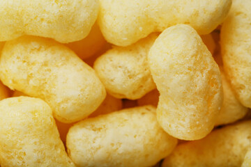 Yellow dessert Corn sticks in powdered sugar texture.