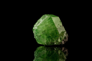 macro mineral stone Demantoid on a black background