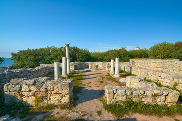 The ruins of an ancient Greek basilica in the evening sun.