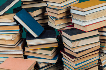 stacks of books for teaching knowledge of the university library green background