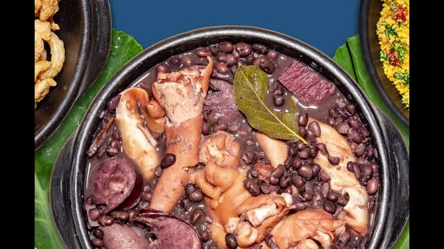 Typical Brazilian feijoada with traditional side dishes 