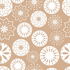 Vector illustration. Merry Christmas and Happy New Year seamless pattern. Lace background with round abstract snowflakes. Perforated bright patterns Papel Picado pattern.