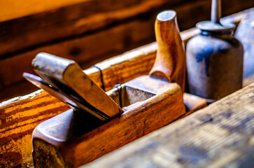 old wooden planer at a workbench