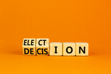 Election and decision symbol. Wooden cubes, changed the word Election to Decision. Beautiful orange background, copy space. Business, election and decision concept.
