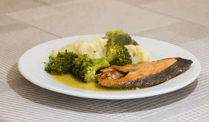 Grilled salmon with cauliflower and broccoli ready to eat. A healthy dish.