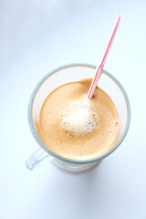 cappuccino top view with a straw