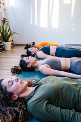 Group meditating in Corpse pose