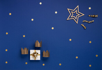 Three gold crowns for Traditional Three King's Day of January 6, blue background.