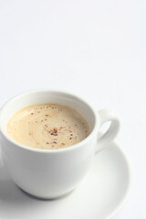 One mug with hot and aromatic coffee is on a gray table. This is breakfast