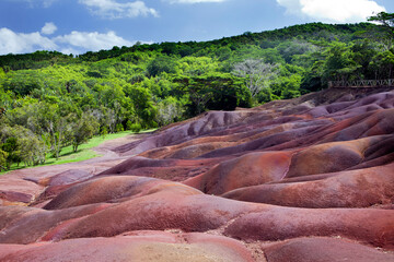 A hillside with brightly color sand in the Chamarel, Mauritius..
