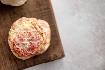 soft fresh cheese sprinkled with paprika selective focus, cheese made from goat milk