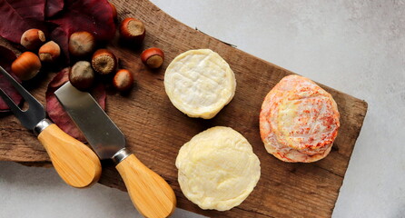 soft fresh cheese sprinkled with paprika selective focus, cheese made from goat milk