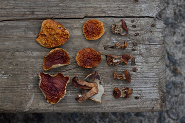 dried boletus edulis mushrooms on the old wooden table with top view
