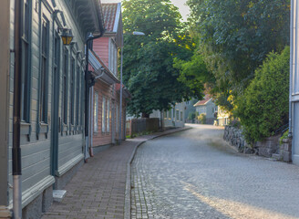 Street with wooden old houses in the historical center of Kungälv, Sweden