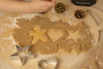 the process of making gingerbread men cookies , christmas cookies