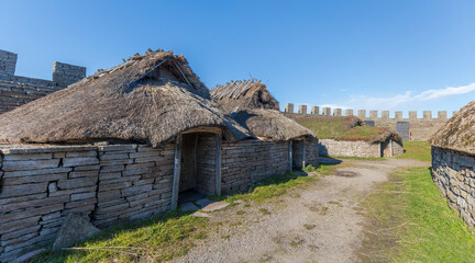 Thatched huts in Eketorps borg, a viking village in &Ouml;land, Sweden
