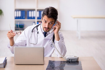 Young male doctor in telemedicine concept