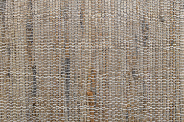 abstract of background woven rug texture in warm tones close up