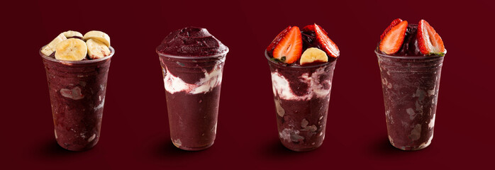 set of many Brazilian frozen açai berry ice cream bowls with diferent ingredients on a purple...