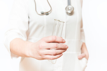doctor holding glass test tubes in his hands on a white background, close-up