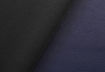 Fototapeta premium blue artificial leather with waves and folds on PVC base