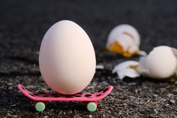 Egg Skateboard Metaphor - 474982257