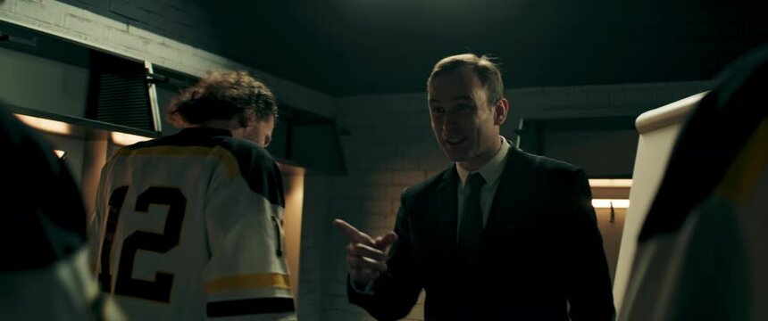 Happy Positive Coach Greeting Ice Hockey Team Players On The Locker Room During The Intermission. Motivation Speech. Shoot With 2x Anamorphic Lens