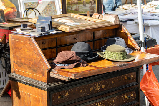 Used hats displayed in a flea market