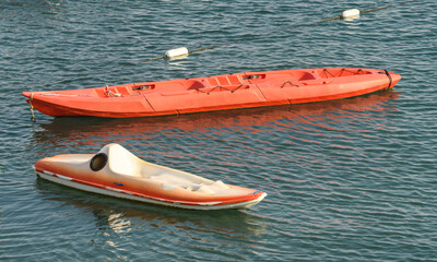 Pair of empty canoes in the sea