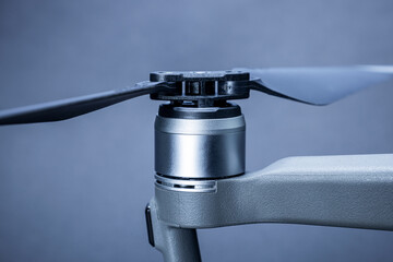 Obraz premium Close-up of drone propellers and brushless motor. Quadcopter blades. Drone maintenance.