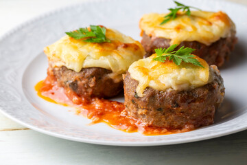 Turkish Food Hasanpasa Kofte - Kofta with Puree - Meatball with Bechamel Sauce and Green Peas. Traditional Food.